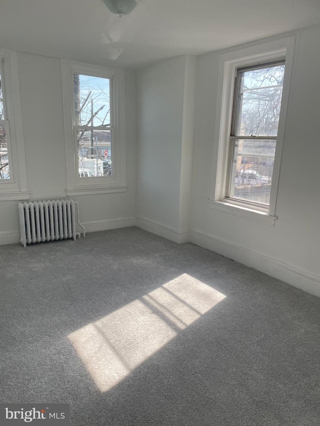 3315 N 11th St, Philadelphia, PA 19140 - carpeted spare room with plenty of natural light, baseboards, and radiator heating unit