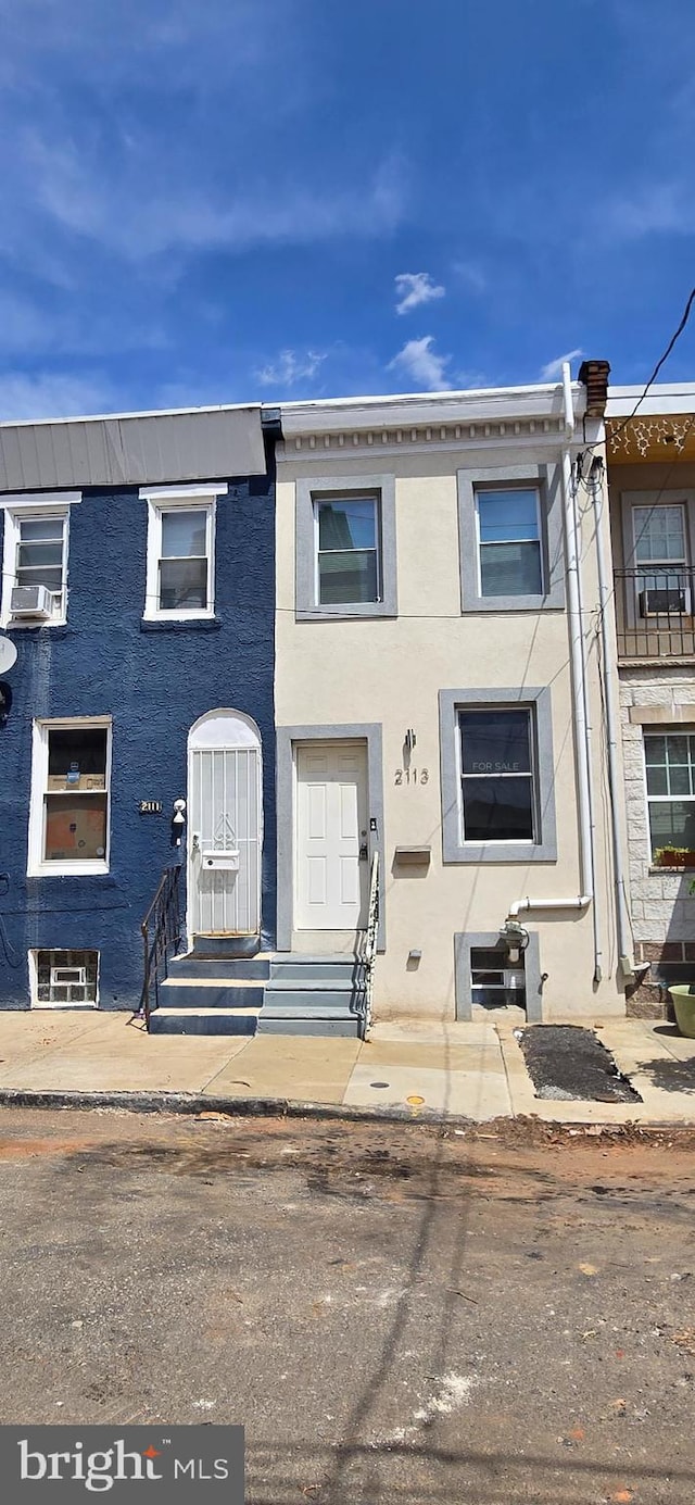 2113 E William St, Philadelphia, PA 19134 - townhome / multi-family property with entry steps and stucco siding