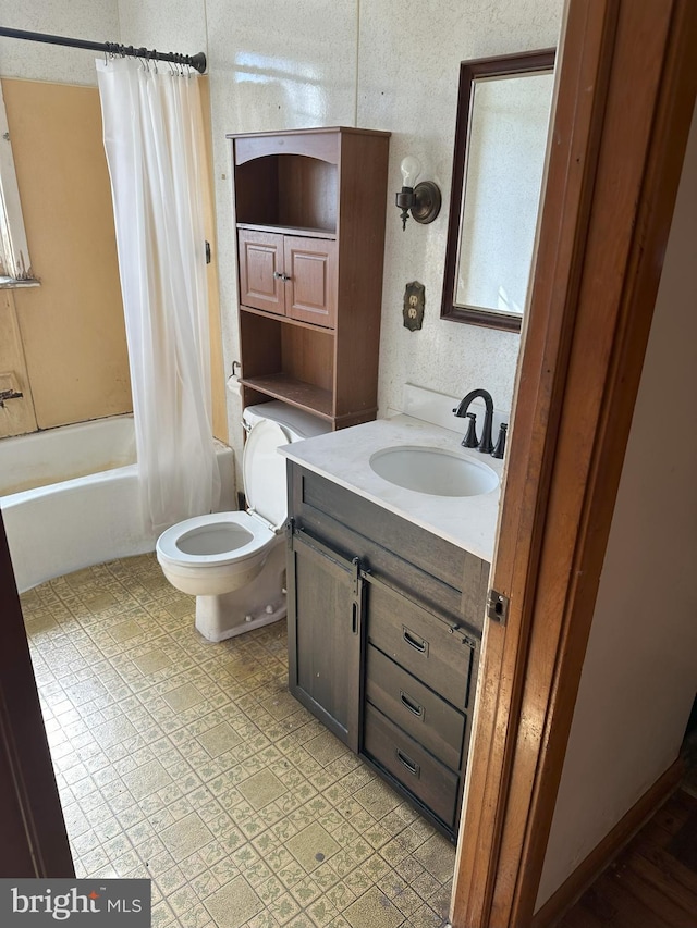 full bath featuring vanity, shower / tub combo, and toilet