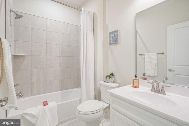 bathroom featuring vanity, shower / bathtub combination with curtain, and toilet