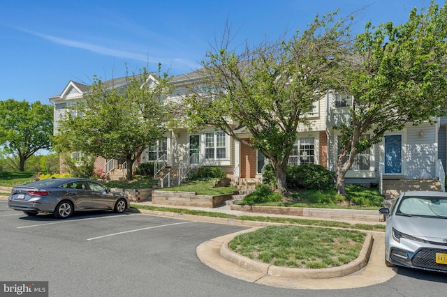 46726 Summit Ter Unit 136, Sterling, VA 20164 - view of front of home with brick siding and uncovered parking