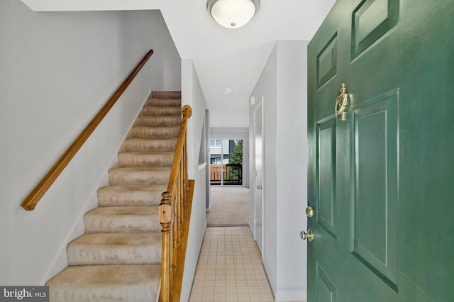 46726 Summit Ter Unit 136, Sterling, VA 20164 - entrance foyer with light colored carpet, stairs, baseboards, and light tile patterned flooring