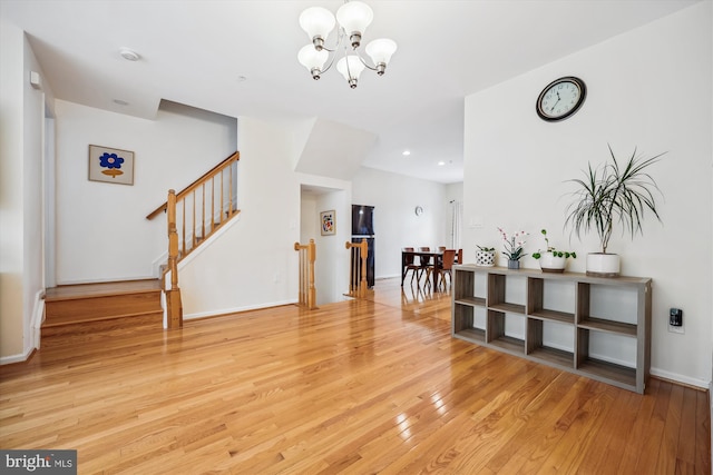 14019 Rockingham Rd, Germantown, MD 20874 - foyer featuring light wood-style flooring, a chandelier, stairway, baseboards, and recessed lighting