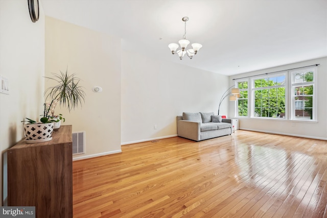 14019 Rockingham Rd, Germantown, MD 20874 - sitting room with a chandelier, light wood-type flooring, and baseboards
