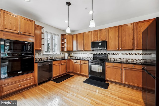 14019 Rockingham Rd, Germantown, MD 20874 - kitchen with black appliances, open shelves, dark countertops, brown cabinets, and recessed lighting