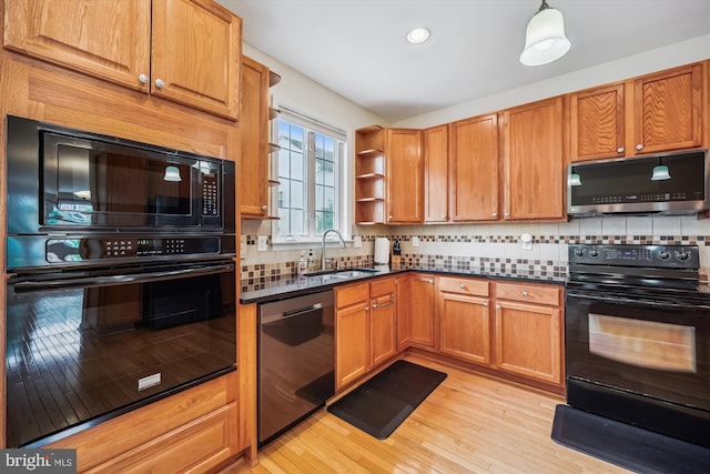 14019 Rockingham Rd, Germantown, MD 20874 - kitchen with black appliances, a sink, open shelves, backsplash, and light wood-style floors