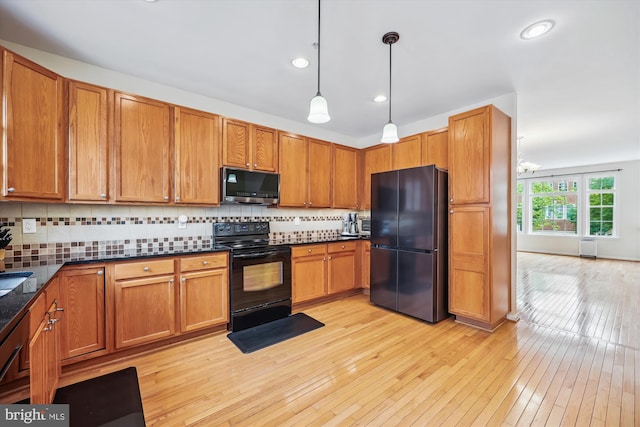 14019 Rockingham Rd, Germantown, MD 20874 - kitchen featuring black appliances, light wood-style floors, decorative backsplash, pendant lighting, and recessed lighting