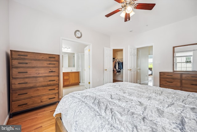 14019 Rockingham Rd, Germantown, MD 20874 - bedroom with a walk in closet, light wood-style floors, connected bathroom, a closet, and ceiling fan