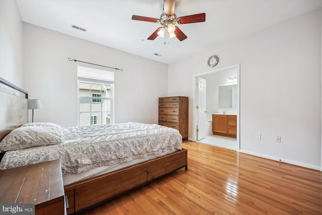 14019 Rockingham Rd, Germantown, MD 20874 - bedroom with light wood-style flooring, baseboards, ensuite bathroom, and ceiling fan