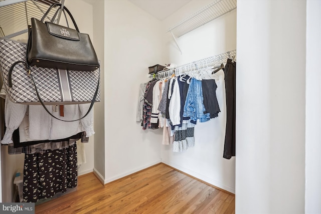 14019 Rockingham Rd, Germantown, MD 20874 - walk in closet featuring wood finished floors