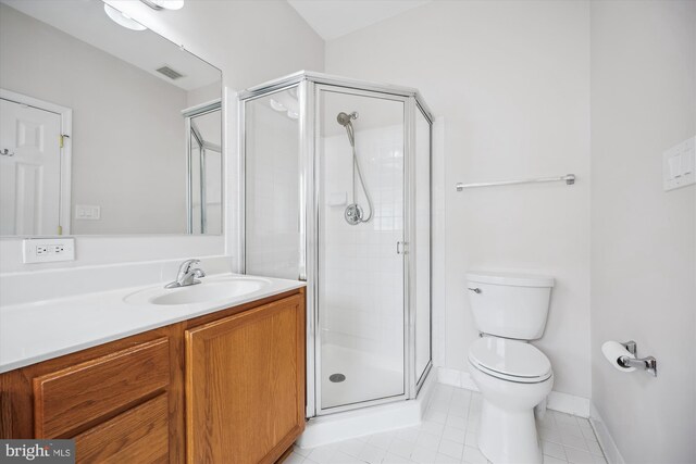 14019 Rockingham Rd, Germantown, MD 20874 - bathroom featuring tile patterned flooring, a stall shower, toilet, vanity, and baseboards