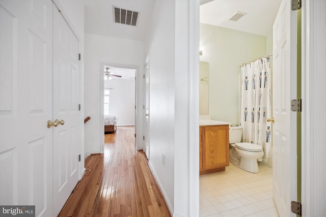 14019 Rockingham Rd, Germantown, MD 20874 - corridor with light wood finished floors and baseboards