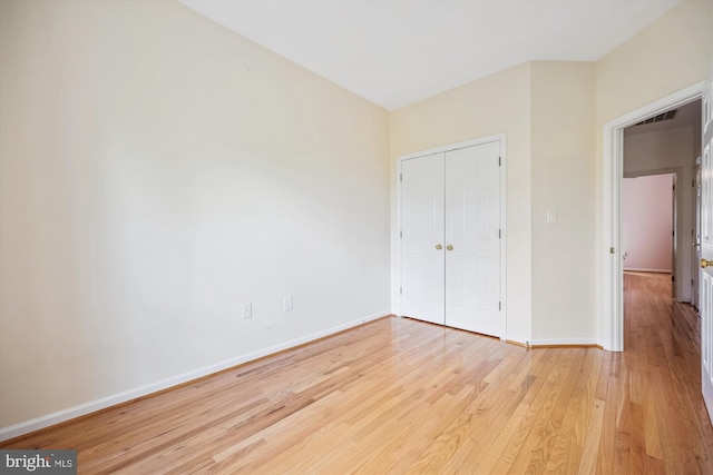 14019 Rockingham Rd, Germantown, MD 20874 - unfurnished bedroom with light wood-style floors, baseboards, and a closet
