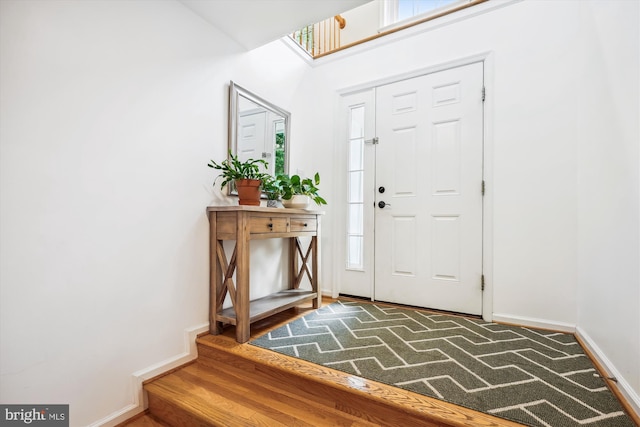 14019 Rockingham Rd, Germantown, MD 20874 - foyer entrance with plenty of natural light, baseboards, and wood finished floors