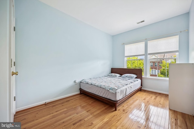 14019 Rockingham Rd, Germantown, MD 20874 - bedroom with hardwood / wood-style floors and baseboards
