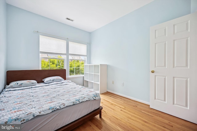 14019 Rockingham Rd, Germantown, MD 20874 - bedroom with light wood-type flooring and baseboards
