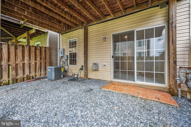 14019 Rockingham Rd, Germantown, MD 20874 - view of exterior entry with cooling unit, fence, and a patio