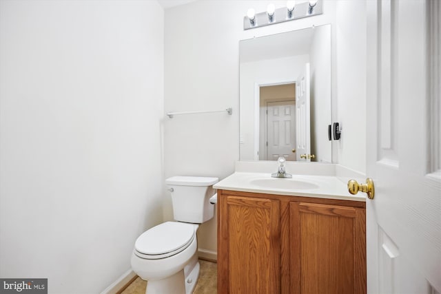 14019 Rockingham Rd, Germantown, MD 20874 - bathroom with toilet, vanity, baseboards, and tile patterned flooring
