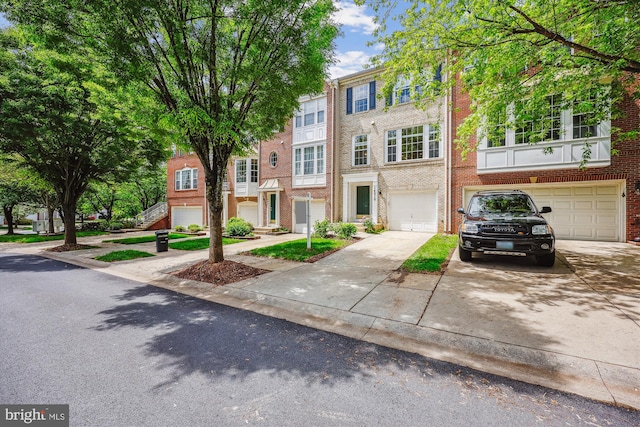 14019 Rockingham Rd, Germantown, MD 20874 - townhome / multi-family property featuring driveway, an attached garage, and brick siding