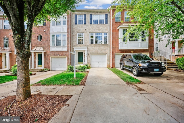 14019 Rockingham Rd, Germantown, MD 20874 - multi unit property with driveway, brick siding, and a garage