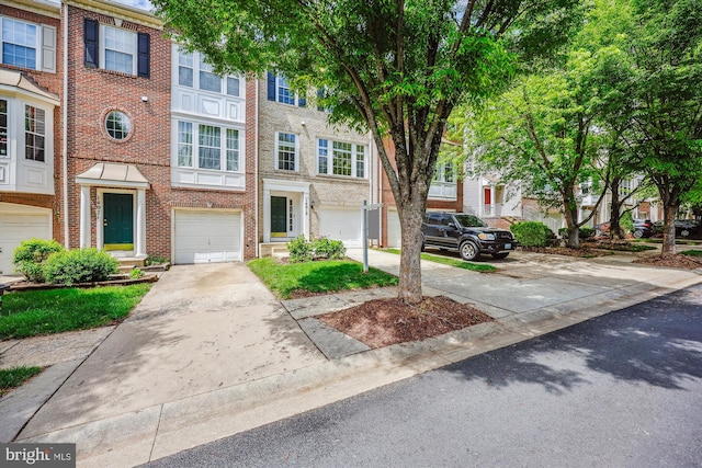 14019 Rockingham Rd, Germantown, MD 20874 - townhome / multi-family property featuring brick siding, driveway, and an attached garage