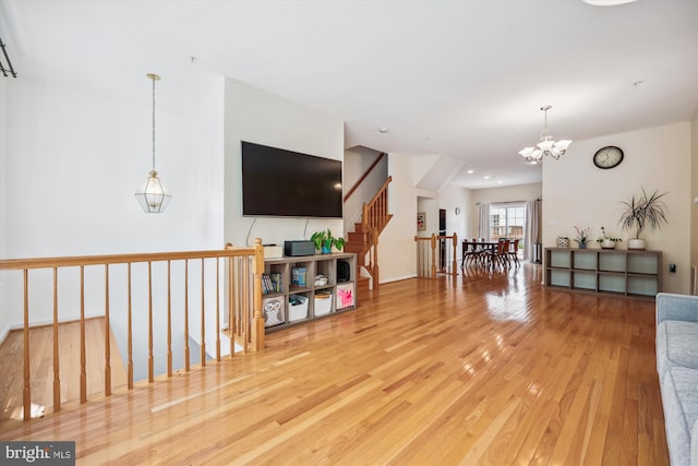 14019 Rockingham Rd, Germantown, MD 20874 - living area with a chandelier and wood-type flooring