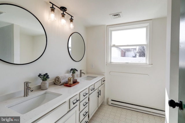 full bathroom with double vanity, a baseboard radiator, visible vents, and a sink