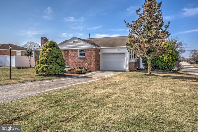 ranch-style home featuring aphalt driveway, a front yard, fence, brick siding, and a garage