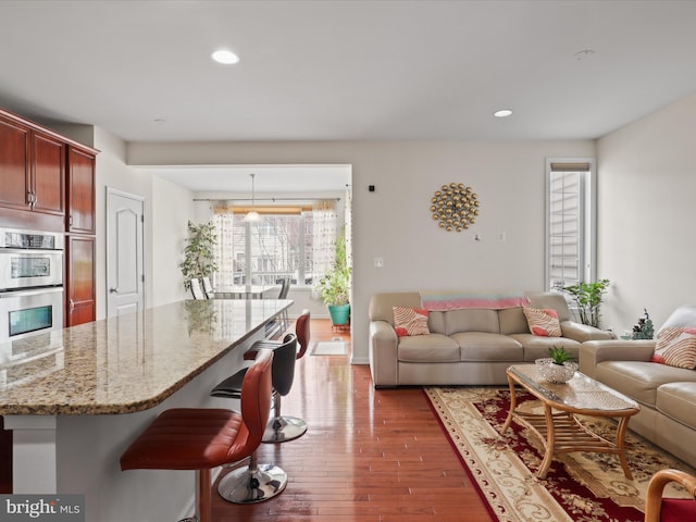 43260 Mitcham Sq, Ashburn, VA 20148 - living area featuring recessed lighting and wood-type flooring