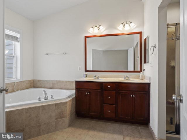 43260 Mitcham Sq, Ashburn, VA 20148 - full bath with tile patterned flooring, a shower stall, double vanity, a bath, and a sink