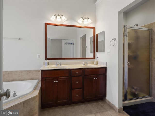 43260 Mitcham Sq, Ashburn, VA 20148 - bathroom featuring a shower stall, a garden tub, double vanity, and a sink