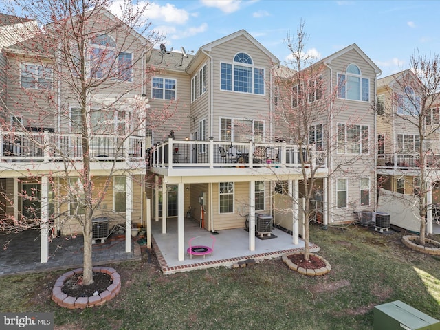 43260 Mitcham Sq, Ashburn, VA 20148 - back of property with a deck, a patio, central air condition unit, and a yard