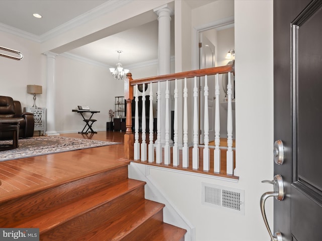 43260 Mitcham Sq, Ashburn, VA 20148 - staircase featuring a chandelier, decorative columns, visible vents, ornamental molding, and wood finished floors