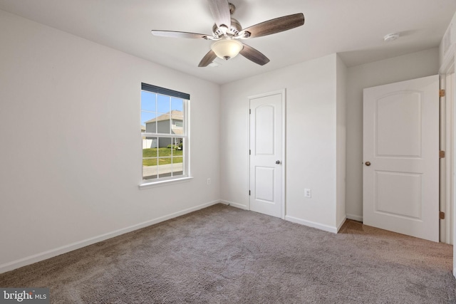 unfurnished bedroom featuring baseboards, ceiling fan, and carpet flooring