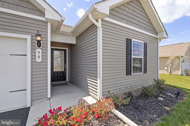 doorway to property featuring a garage