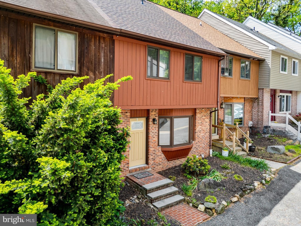 49 Helios Ct, Newark, DE 19711 - view of property featuring brick siding and roof with shingles