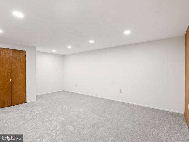 below grade area featuring recessed lighting, baseboards, and carpet