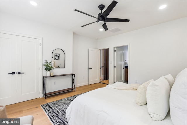 bedroom featuring recessed lighting, wood finished floors, and a ceiling fan