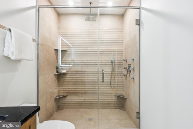 full bath featuring toilet and a shower stall