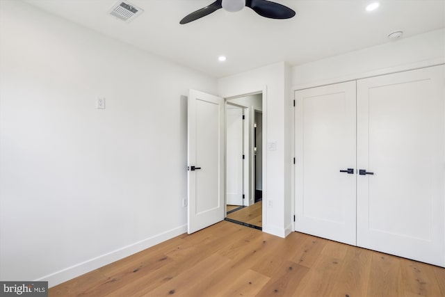unfurnished bedroom with light wood-style flooring, baseboards, recessed lighting, a closet, and ceiling fan
