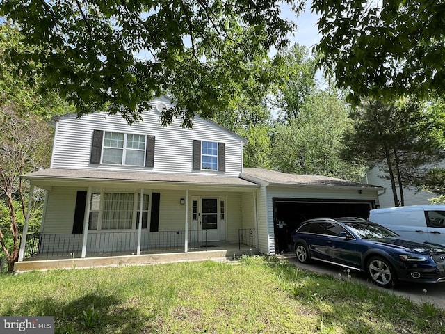 10604 Nast Dr, Cheltenham, MD 20623 - view of front of property with a garage, a porch, and a front yard