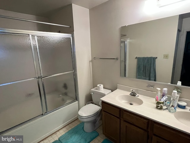10604 Nast Dr, Cheltenham, MD 20623 - full bathroom with toilet, double vanity, a sink, and bath / shower combo with glass door