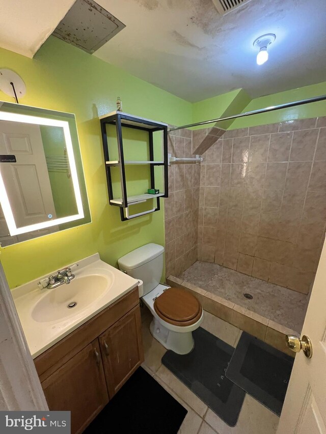 10604 Nast Dr, Cheltenham, MD 20623 - bathroom featuring tile patterned floors, vanity, toilet, and tiled shower