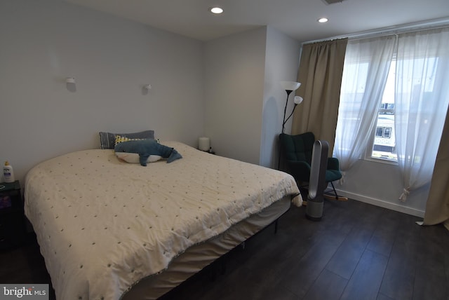 bedroom featuring dark wood-style floors, recessed lighting, and baseboards