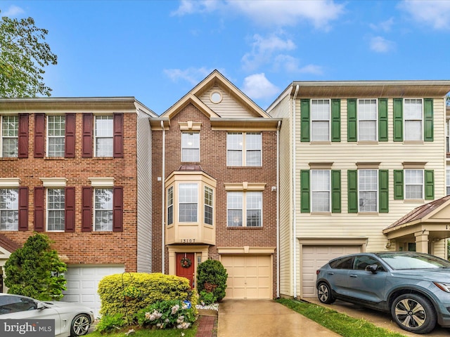 13107 Bridger Dr Unit 104, Germantown, MD 20874 - multi unit property featuring a garage, driveway, and brick siding