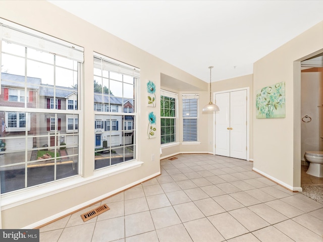 13107 Bridger Dr Unit 104, Germantown, MD 20874 - spare room featuring baseboards and light tile patterned floors