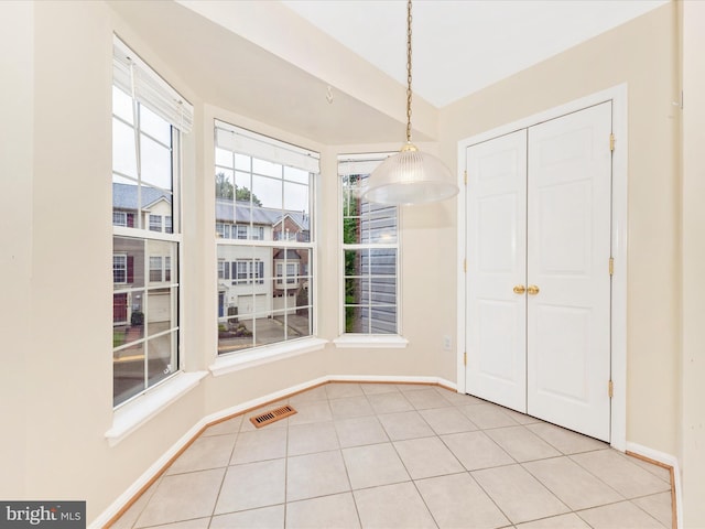 13107 Bridger Dr Unit 104, Germantown, MD 20874 - unfurnished dining area featuring baseboards and tile patterned floors