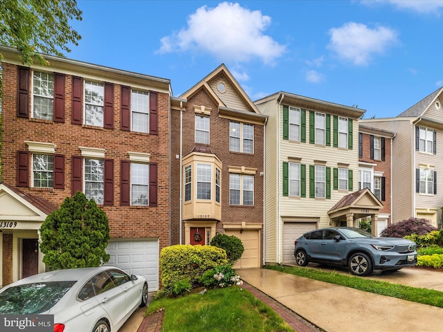 13107 Bridger Dr Unit 104, Germantown, MD 20874 - multi unit property with driveway, a garage, and brick siding
