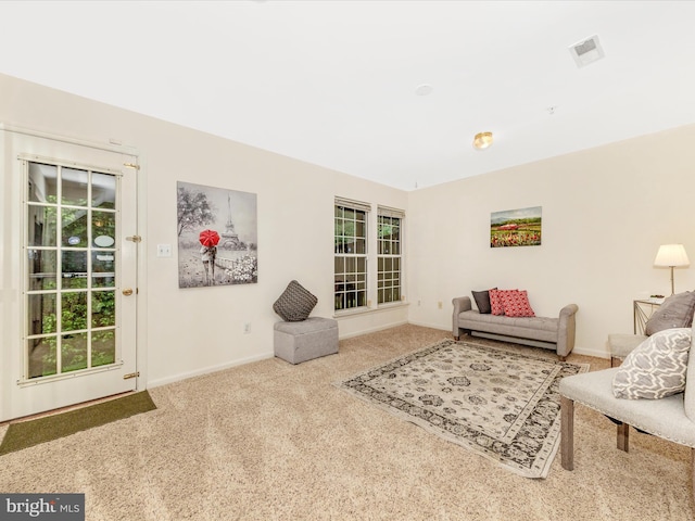 13107 Bridger Dr Unit 104, Germantown, MD 20874 - carpeted living room with baseboards and healthy amount of natural light