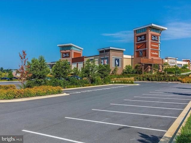 13107 Bridger Dr Unit 104, Germantown, MD 20874 - view of building exterior featuring uncovered parking
